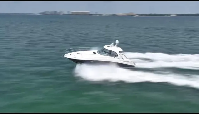 Slide: The Image of 2007 Sea Ray 40 Sundancer cruising swiftly on open water. - 4