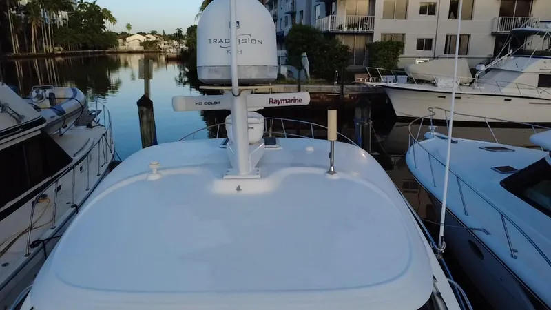 Slide: The Image of 2007 Sea Ray 40 Sundancer docked, featuring radar and navigation equipment. - 43