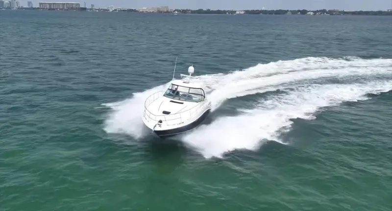 Slide: The Image of 2007 Sea Ray 40 Sundancer cruising swiftly on open water. - 8