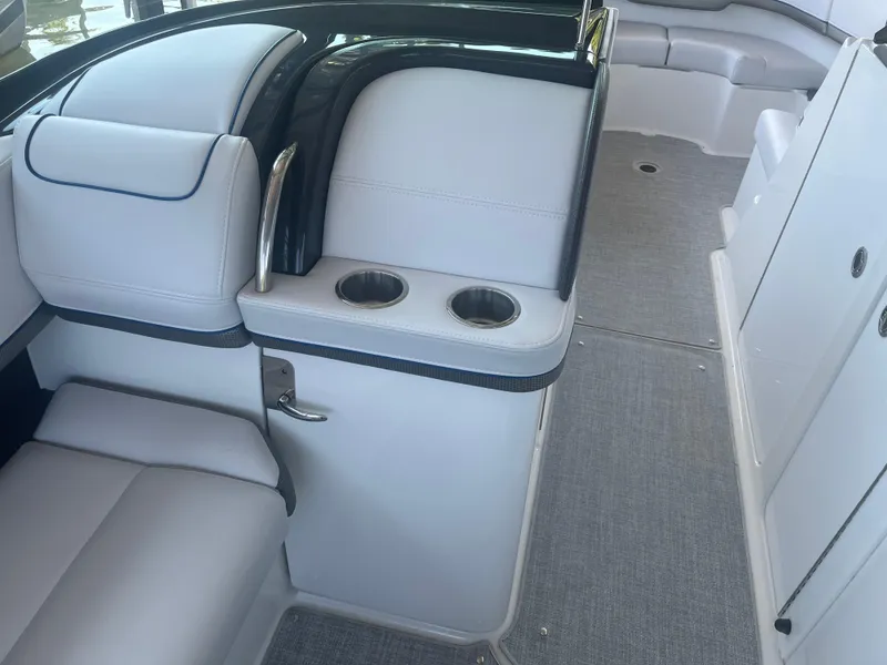 Slide: The Image of Interior of 2023 Formula 310 Bowrider I/O, featuring sleek seating and cup holders. - 12