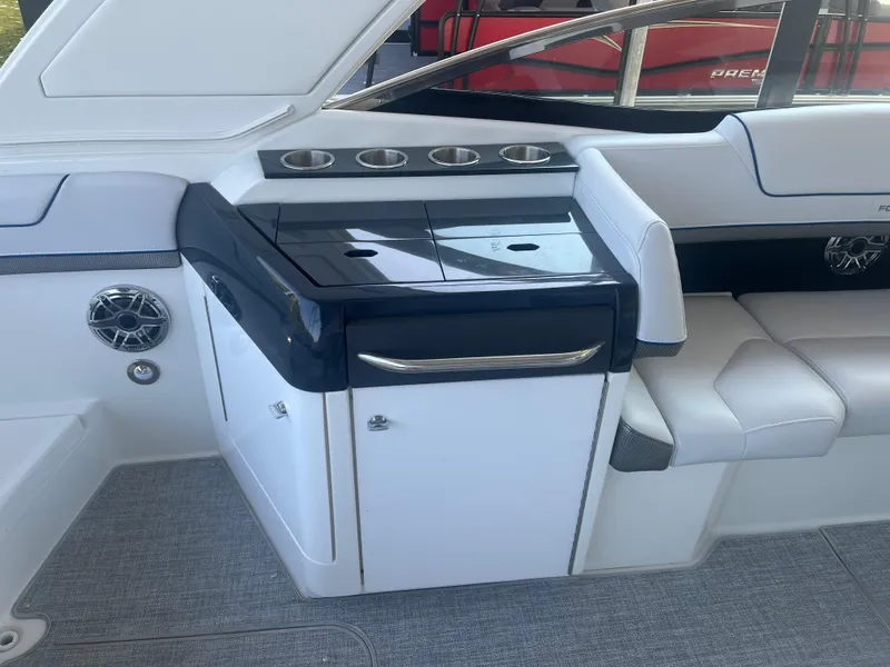 Slide: The Image of 2023 Formula 310 Bowrider I/O interior with seating and storage area. - 7