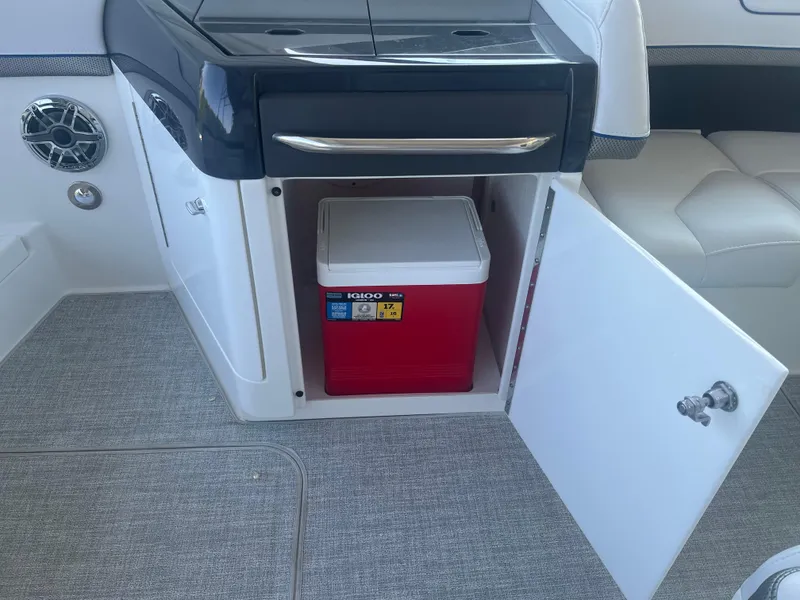 Slide: The Image of 2023 Formula 310 Bowrider I/O with Igloo cooler in storage compartment. - 8