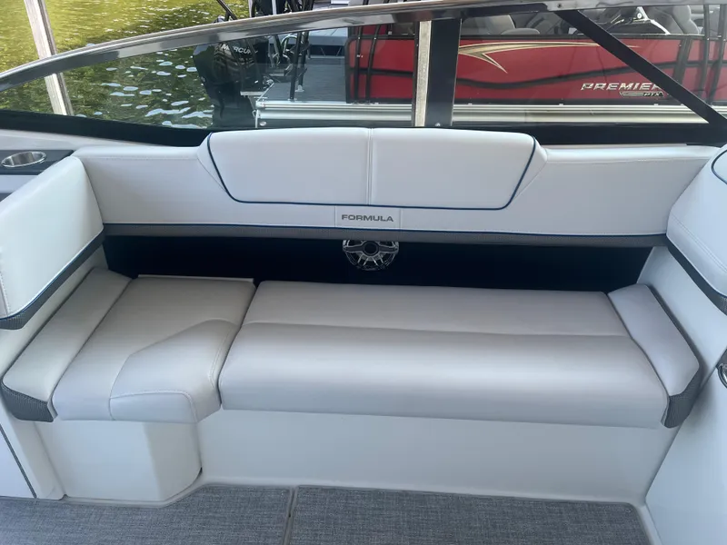 Slide: The Image of 2023 Formula 310 Bowrider I/O interior with white seating and sleek design. - 9