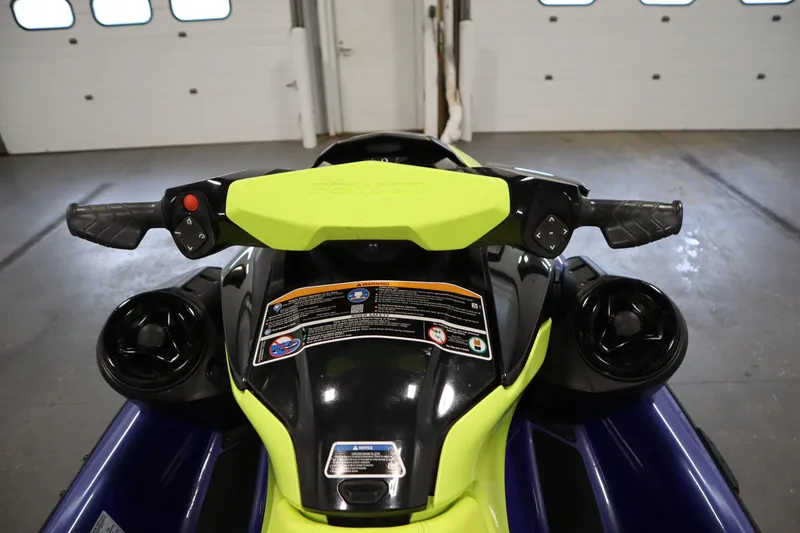 Slide: The Image of 2020 Sea-Doo Wake 170 SS handlebars and controls in a garage setting. - 11