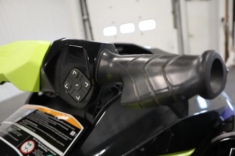 Slide: The Image of Close-up of 2020 Sea-Doo Wake 170 SS handlebar with control buttons. - 13