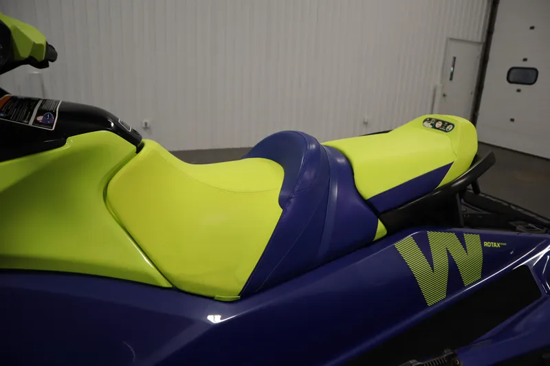 Slide: The Image of 2020 Sea-Doo Wake 170 SS jet ski with vibrant yellow and blue seat design. - 20