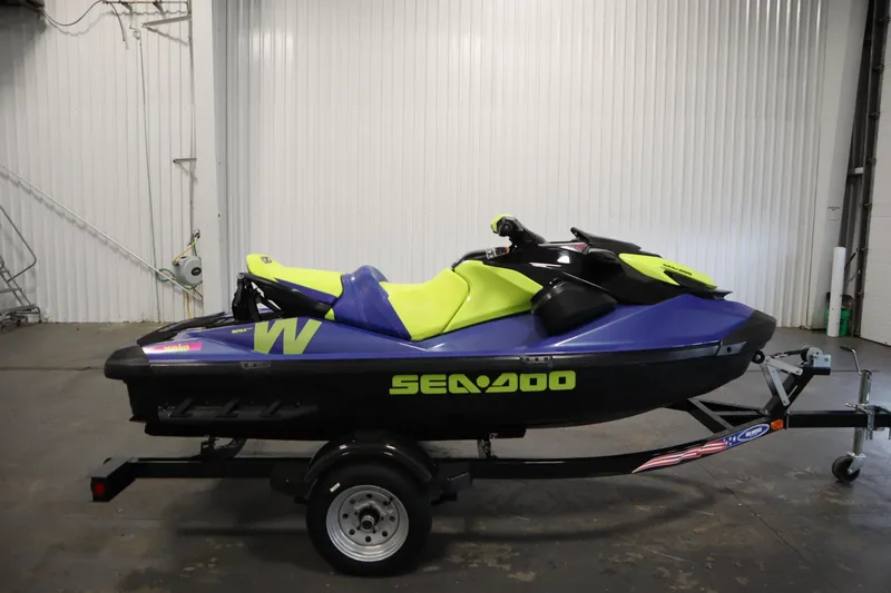 Slide: The Image of 2020 Sea-Doo Wake 170 SS jet ski on trailer in indoor setting. - 4