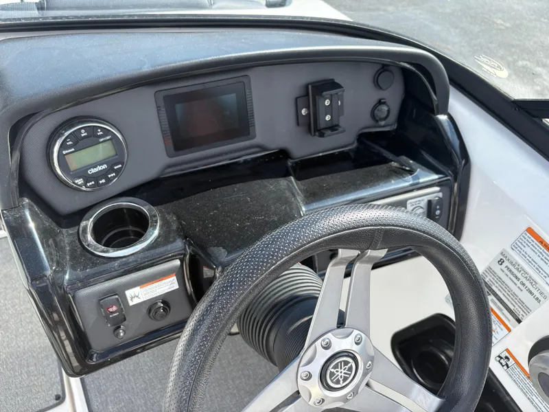 Slide: The Image of 2019 Yamaha AR195 boat dashboard with steering wheel and controls. - 11