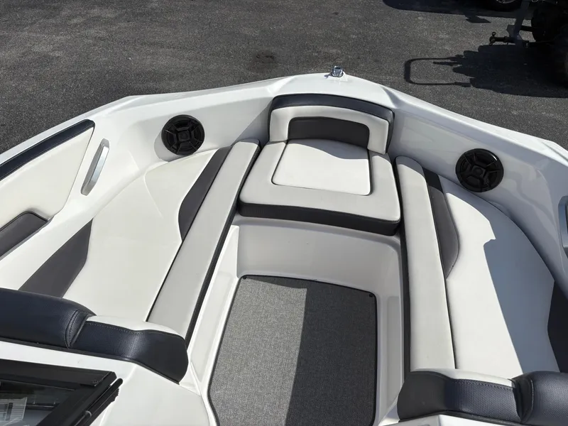 Slide: The Image of 2019 Yamaha AR195 boat interior with cushioned seating and speakers. - 12