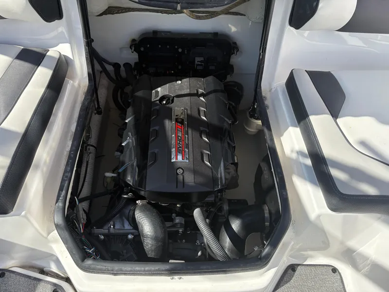 Slide: The Image of 2019 Yamaha AR195 boat engine compartment, showcasing powerful engine components. - 18