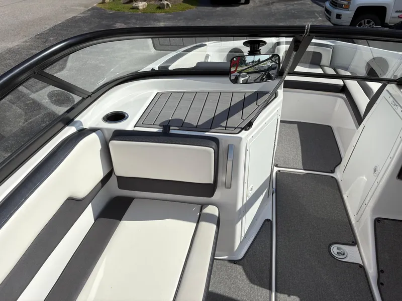 Slide: The Image of 2019 Yamaha Boats AR195 interior with cushioned seating and sleek design. - 9
