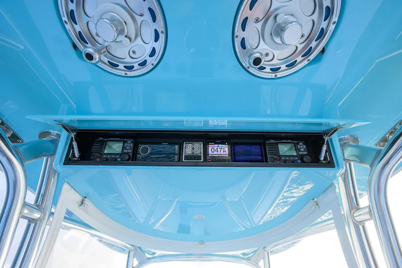 Slide: The Image of 2022 Valhalla Boatworks V-37 helm electronics with blue overhead panel. - 10