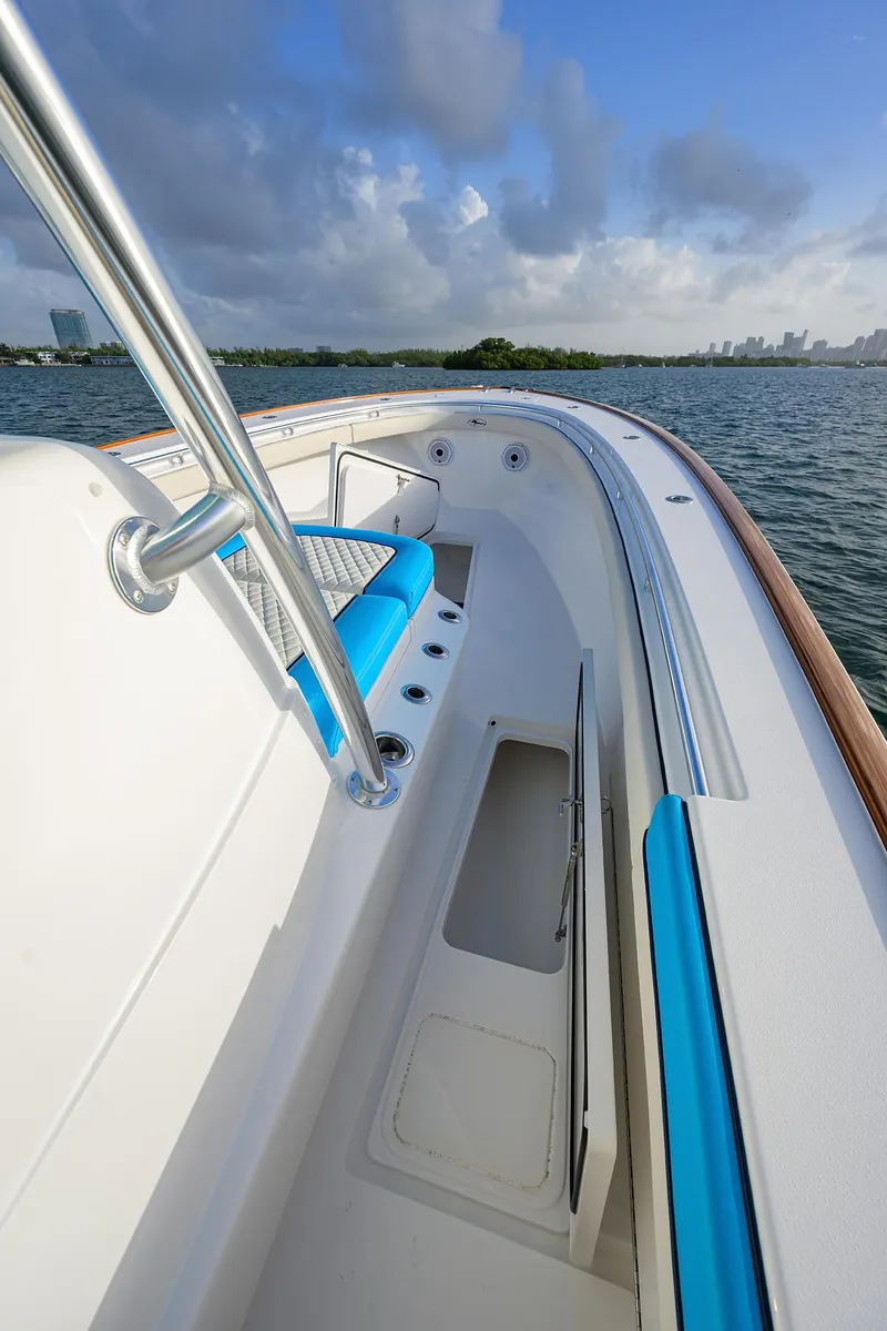 Slide: The Image of 2022 Valhalla Boatworks V-37, sleek design, blue accents, ocean view. - 14