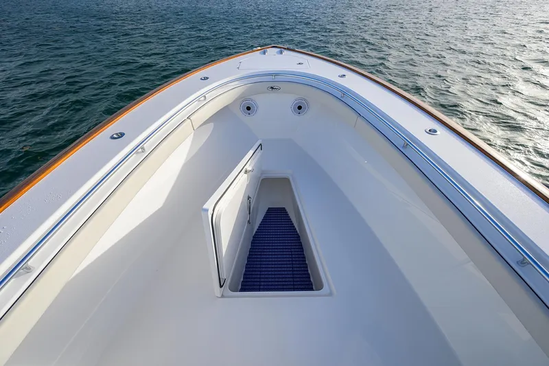 Slide: The Image of 2022 Valhalla Boatworks V-37 bow view on water, showcasing sleek design and storage. - 15