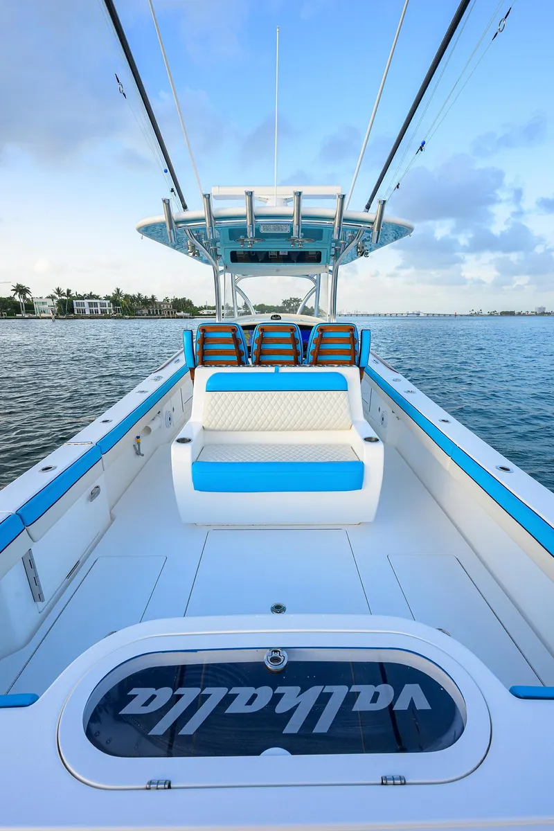 Slide: The Image of 2022 Valhalla Boatworks V-37 on water, showcasing spacious deck and seating. - 16