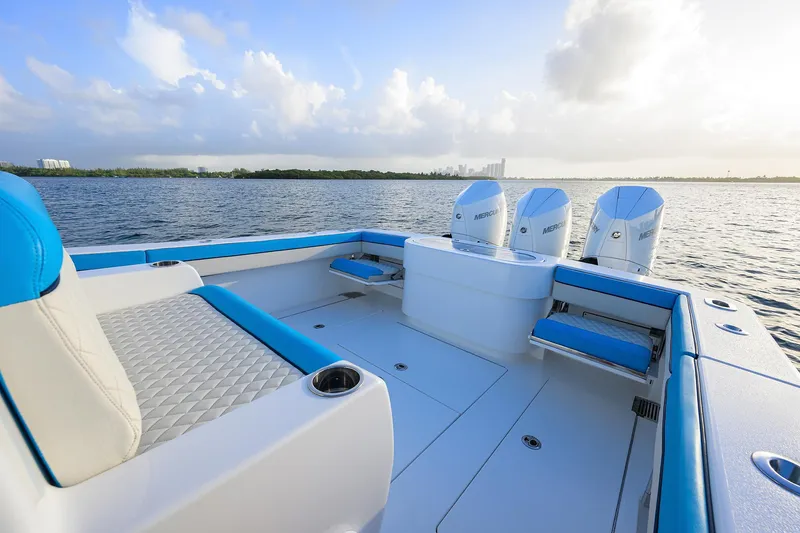 Slide: The Image of 2022 Valhalla Boatworks V-37 with triple Mercury engines on calm water. - 17