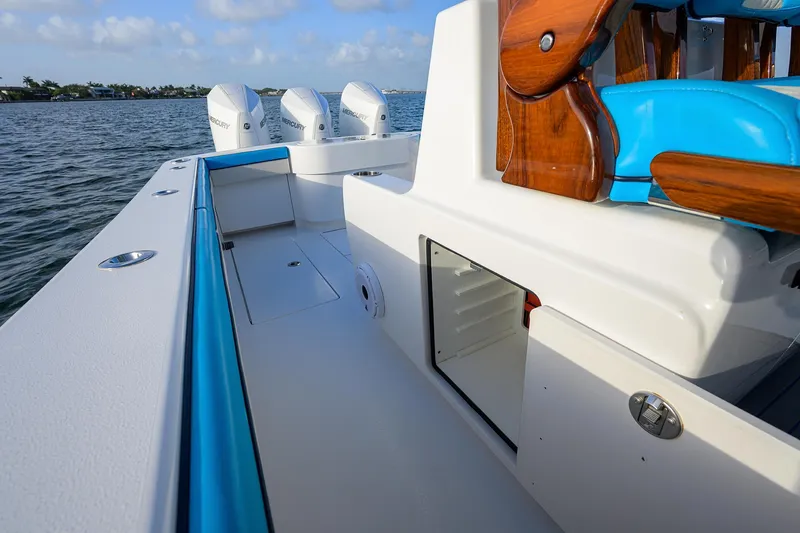 Slide: The Image of 2022 Valhalla Boatworks V-37 with Mercury engines, featuring sleek design and vibrant blue accents. - 20