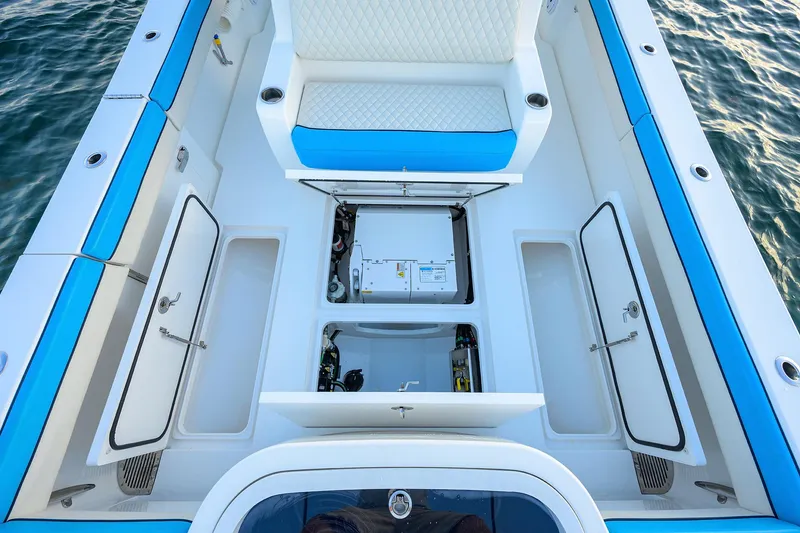 Slide: The Image of 2022 Valhalla Boatworks V-37 interior with open storage compartments and seating. - 23