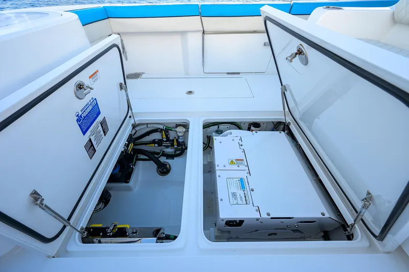 Slide: The Image of 2022 Valhalla Boatworks V-37 storage compartments with open hatches, showcasing internal equipment. - 24