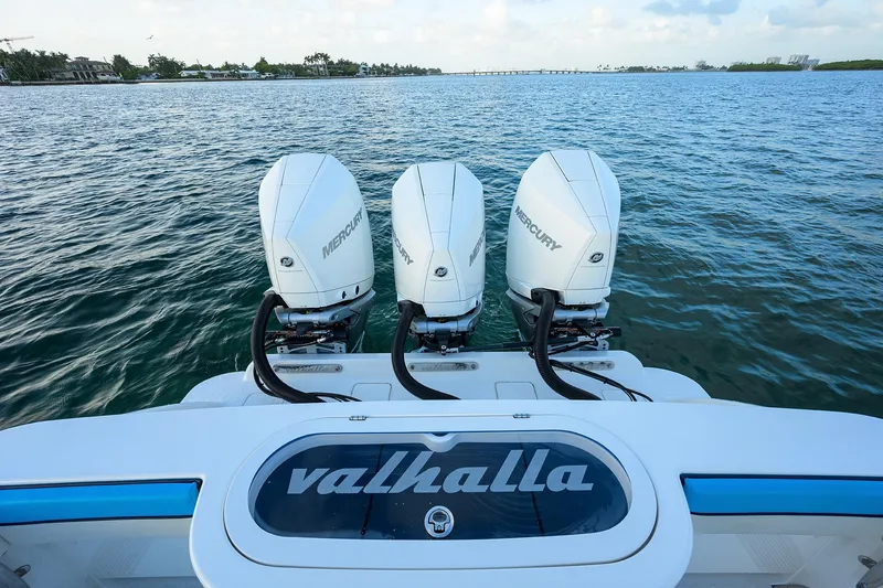 Slide: The Image of 2022 Valhalla V-37 boat with triple Mercury outboard engines on open water. - 26