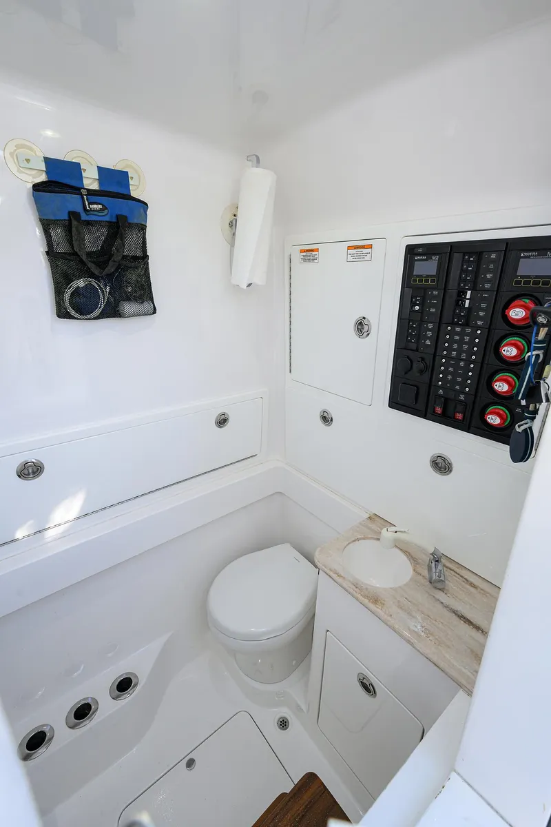 Slide: The Image of 2022 Valhalla V-37 boat interior with toilet, sink, and control panel. - 27