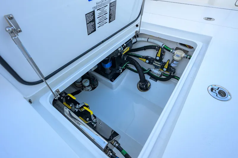 Slide: The Image of 2022 Valhalla Boatworks V-37 engine compartment with visible wiring and components. - 29