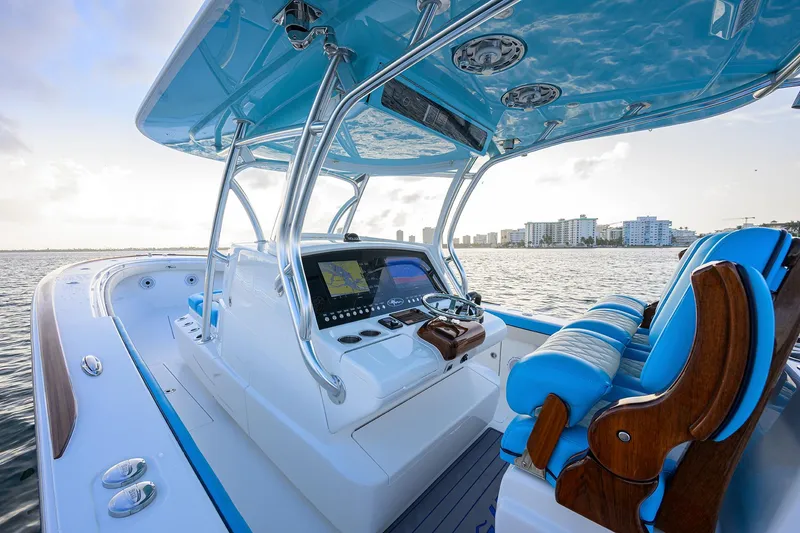 Slide: The Image of 2022 Valhalla Boatworks V-37 helm with blue seating, overlooking city skyline. - 6