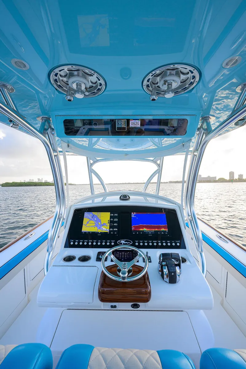 Slide: The Image of 2022 Valhalla Boatworks V-37 helm with advanced navigation displays and controls. - 8
