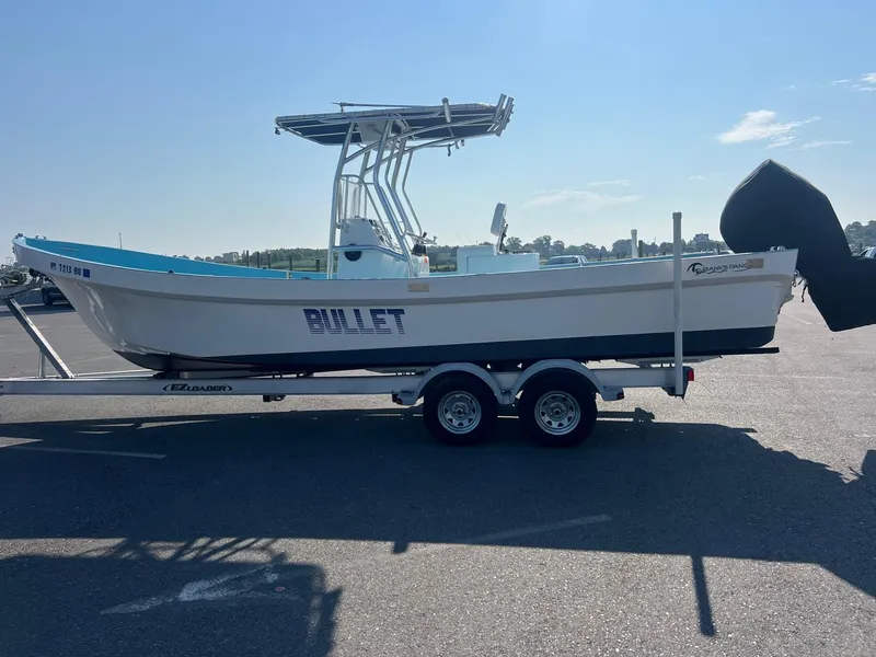 Slide: The Image of 2023 Banks Panga 26 Panga boat on trailer in parking lot. - 4