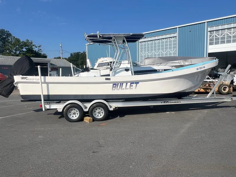 Slide: The Image of 2023 Banks Panga 26 Panga boat on trailer, parked outdoors. - 5