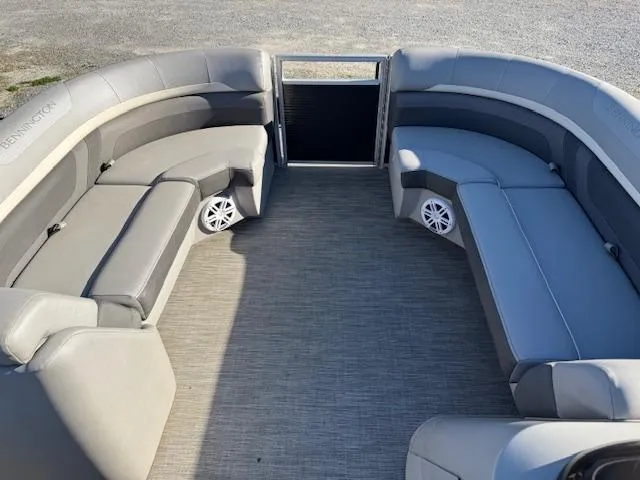 Slide: The Image of 2020 Bennington SX22 pontoon boat interior with gray seating and speakers. - 10
