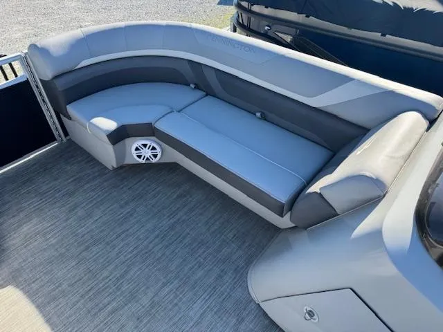 Slide: The Image of 2020 Bennington SX22 boat interior with gray seating and speaker. - 11