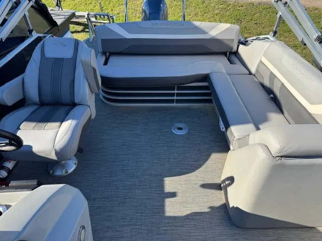 Slide: The Image of 2020 Bennington SX22 boat interior with gray seating and carpeted floor. - 13