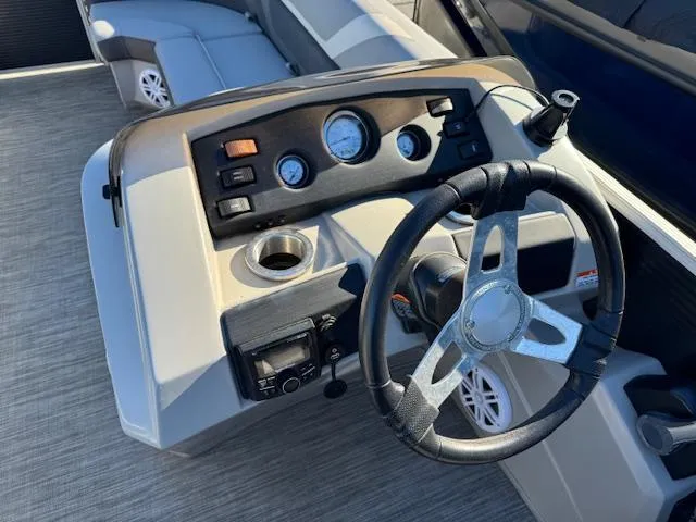 Slide: The Image of 2020 Bennington SX22 boat dashboard with steering wheel and control panel. - 16