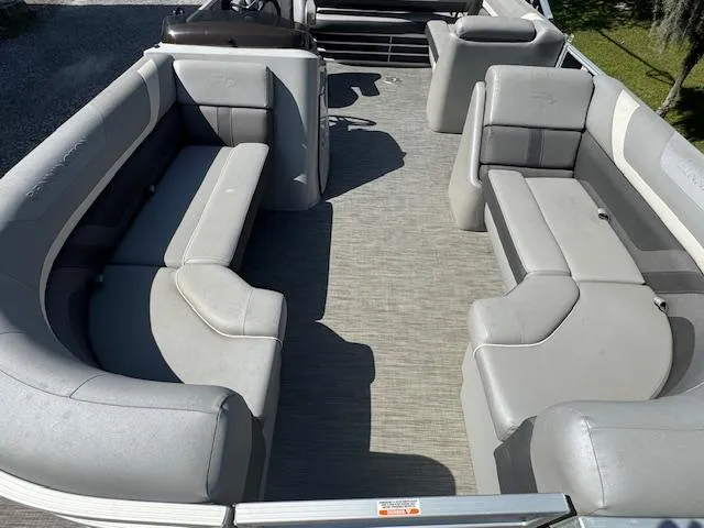Slide: The Image of 2020 Bennington SX22 pontoon boat interior with gray seating and spacious layout. - 21