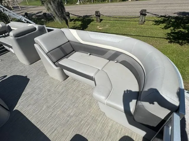 Slide: The Image of 2020 Bennington SX22 boat interior with gray seating and carpeted floor. - 22