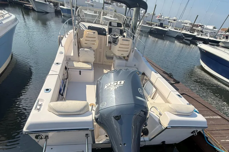 Slide: The Image of 2011 Grady-White 226 Seafarer WA boat docked, featuring Yamaha 250 HP engine. - 2