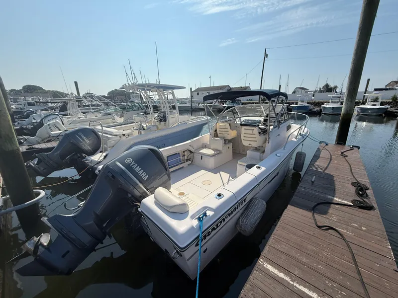Slide: The Image of 2011 Grady-White 226 Seafarer WA boat docked with Yamaha outboard motor. - 3