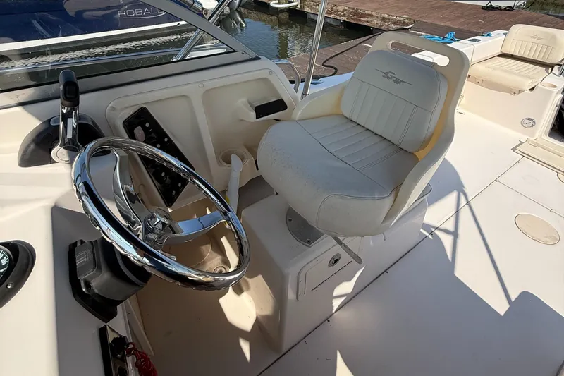 Slide: The Image of Helm of 2011 Grady-White 226 Seafarer WA with steering wheel and captain's chair. - 4