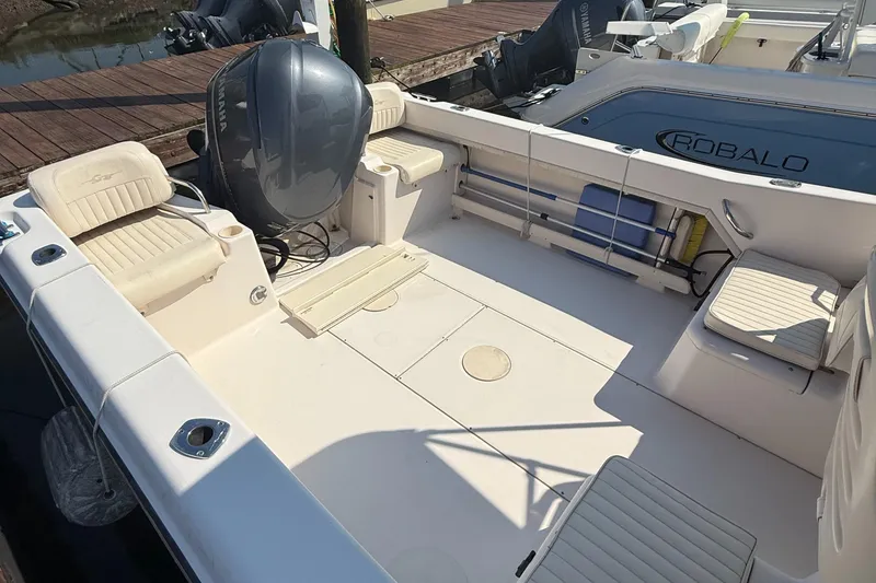 Slide: The Image of 2011 Grady-White 226 Seafarer WA boat interior with seating and Yamaha engine. - 6