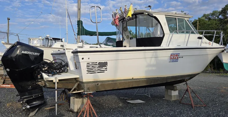 The Image of 2008 Baha Cruisers 277 GLE OB boat with Mercury outboard engine, for sale on land. - 0
