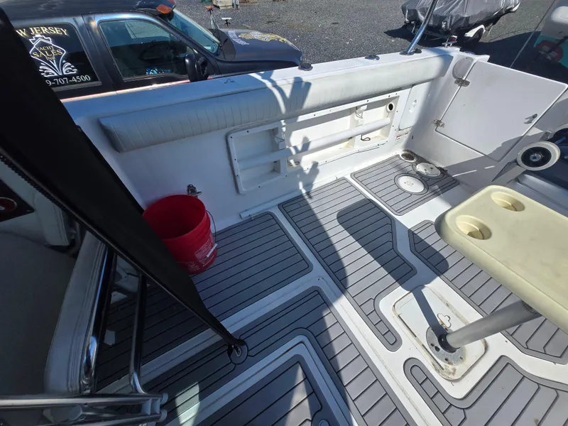Slide: The Image of 2008 Baha Cruisers 277 GLE OB boat for sale, displayed on stands with Mercury outboard. - 10