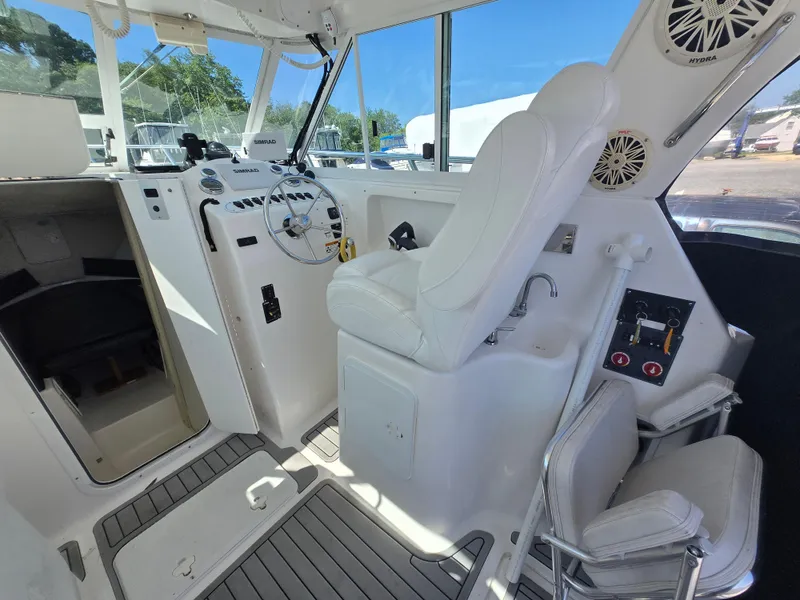 Slide: The Image of 2008 Baha Cruisers 277 GLE OB boat interior with equipment and seating. - 12