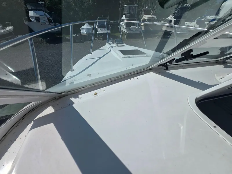 Slide: The Image of 2008 Baha Cruisers 277 GLE OB boat interior with steering wheel and coiled cables. - 14