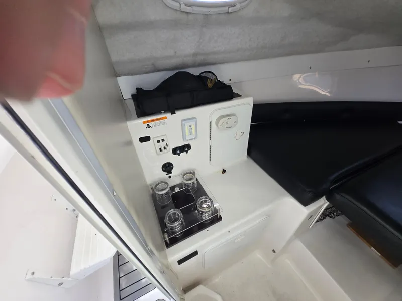 Slide: The Image of Interior of 2008 Baha Cruisers 277 GLE OB boat with seating and control panel. - 17