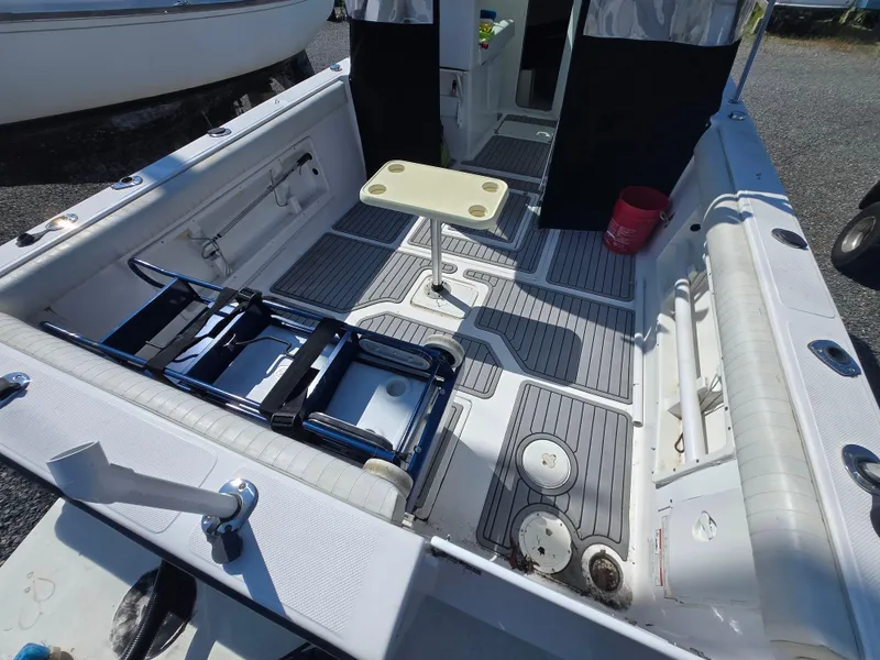 Slide: The Image of 2008 Baha Cruisers 277 GLE OB boat interior with seating and storage compartments. - 5