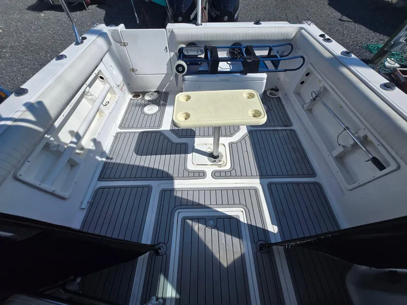 Slide: The Image of 2008 Baha Cruisers 277 GLE OB boat deck with seating and table. - 8