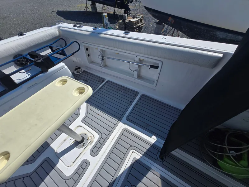 Slide: The Image of 2008 Baha Cruisers 277 GLE OB boat interior with seating and storage compartments. - 9