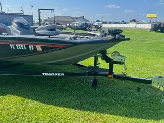 Slide: The Image of 2016 Tracker Pro Team 195 TXW boat on trailer, parked on grass. - 10