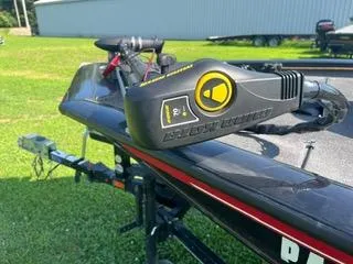 Slide: The Image of 2016 Tracker Pro Team 195 TXW boat with trolling motor on trailer. - 11
